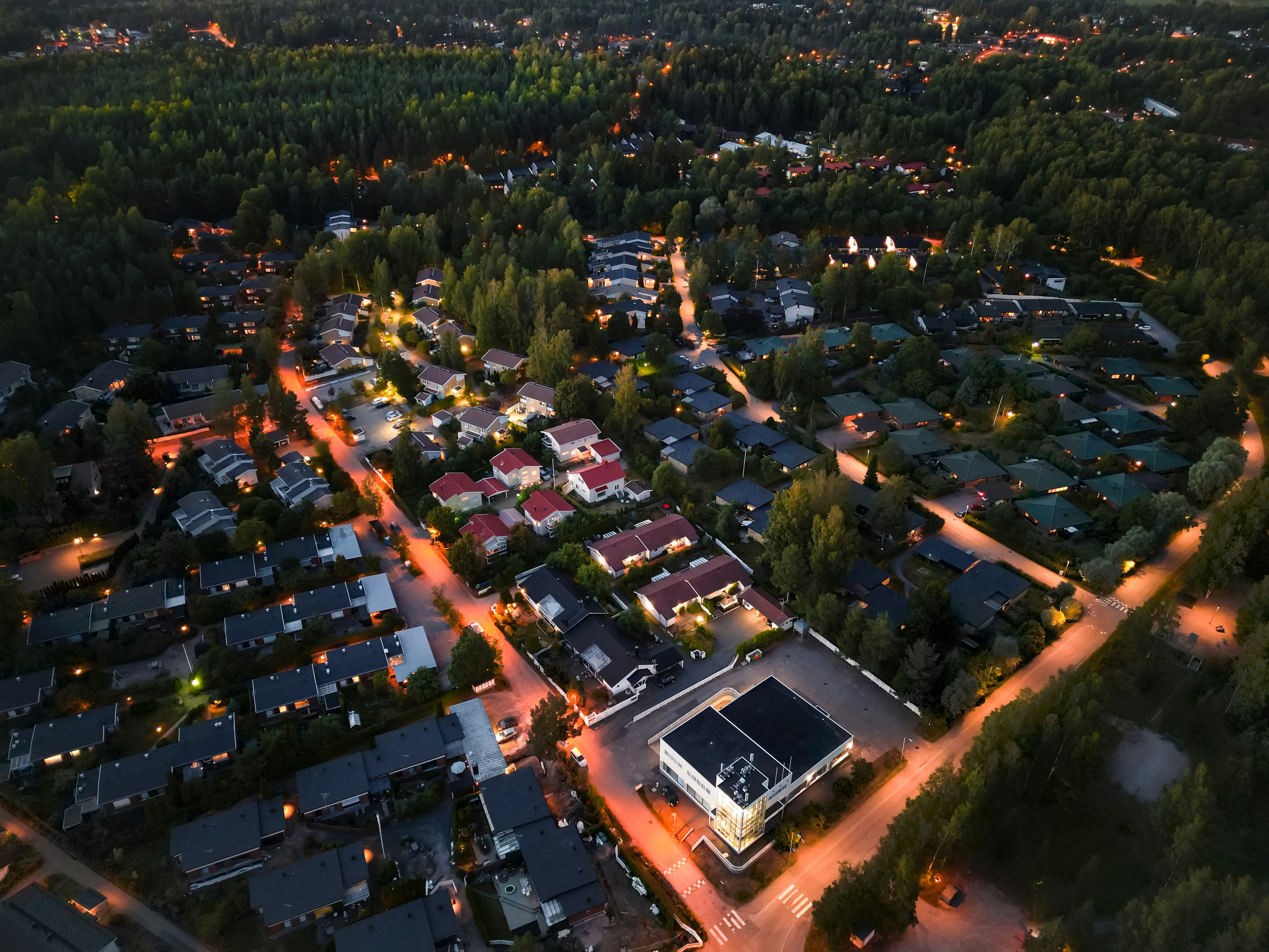 neighborhood with lights on at night