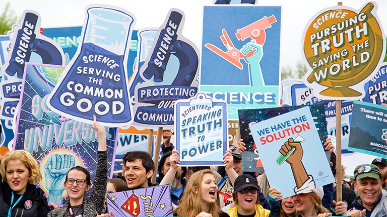People with signs at a Climate March