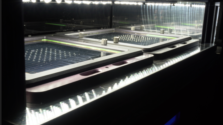 Two 150mm perovskite mini-modules are tested in an accelerated degradation system at CubicPV under 1 sun illumination on a temperature-controlled stage at 75 degrees Celsius.