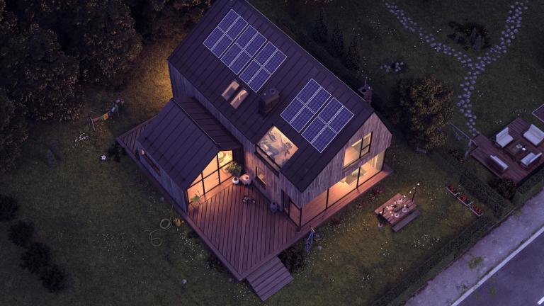 Aerial view of home with rooftop solar panels at night