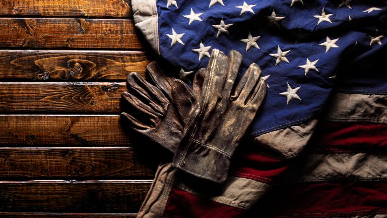 US flag with worker gloves