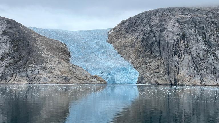 A glacier flows into a fjord in the southwest coast of Greenland.