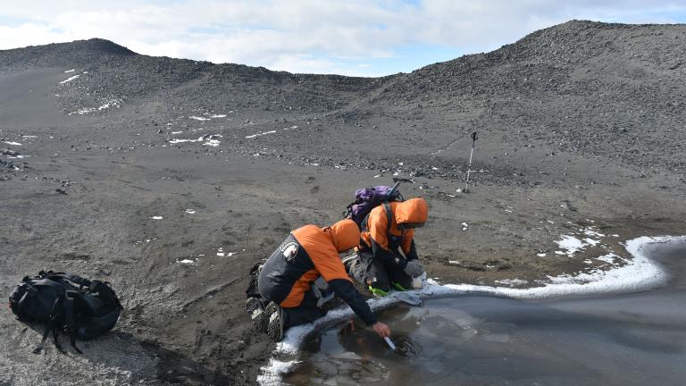 Researchers Ian Hawes of the University of Waikato and Marc Schallenberg of the University of Otago measure the physicochemical conditions of a meltwater pond.