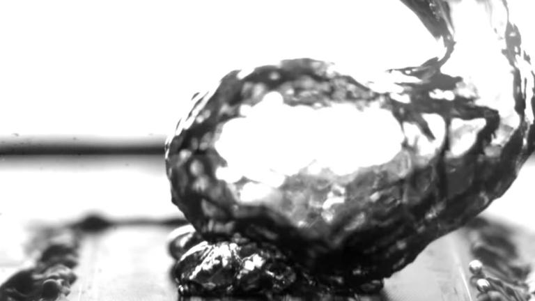 High-speed video of the researchers’ test setup shows water boiling on a specially treated surface, which causes bubbles to form at specific separate points rather than spreading out in a film across the surface, thus leading to more efficient boiling. The video has been slowed down by 100 times to show more detail.