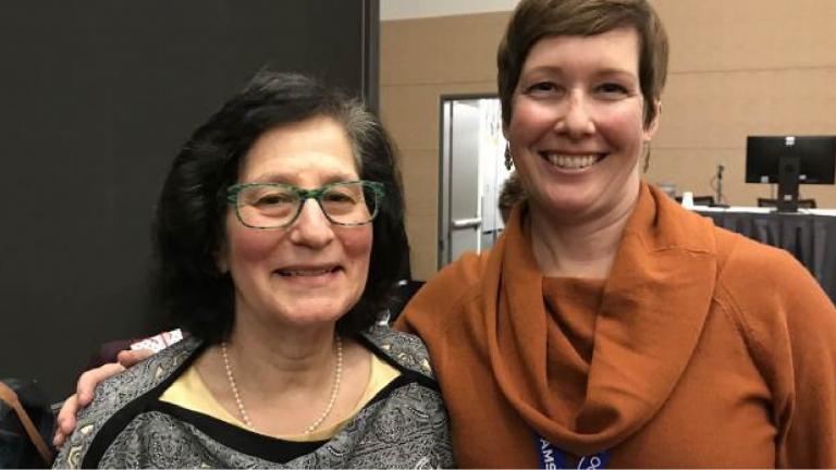 Susan Solomon standing with Jessica Neu PhD ’01, who spoke fondly of being in 7th grade and seeing pictures of Solomon in the Antarctic in her science class.