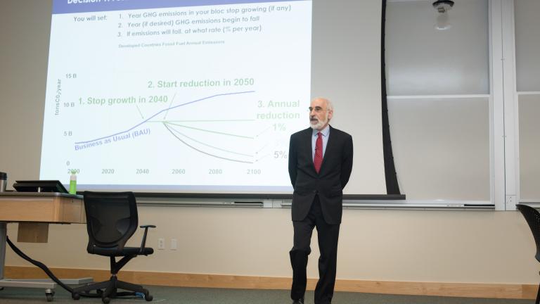 MIT Sloan Professor John Sterman making a presentation related to the climate policy simulators.