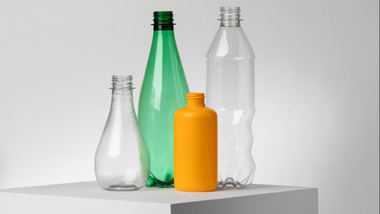 2 clear, 1 orange, and 1 green plastic bottles