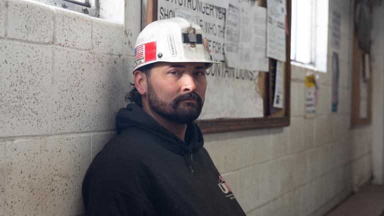Dillion Grimmett, a coal miner who works at Gentry, sits in the mine’s main office entryway.