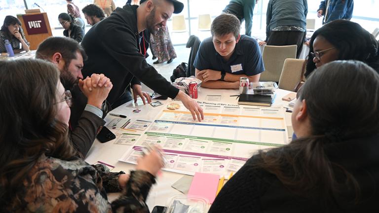 Living Climate Futures Symposium participants worked together to identify potential pros, cons, and trade-offs of allowing a data center to be built in a fictitious community. 