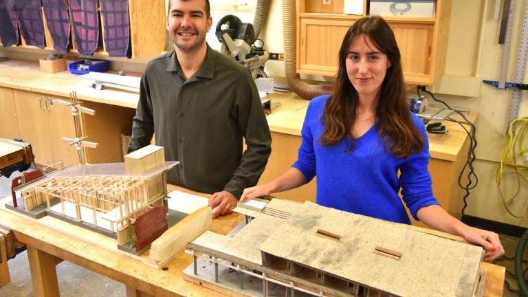 Architecture students Vincent Jackow (left) and Aleks Banaś with the models they constructed in their design studio course.