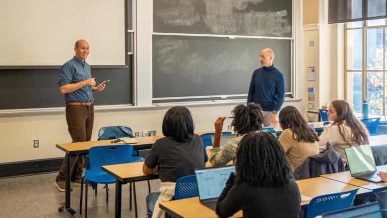 Class STS.059 (The Bioeconomy and Society) is taught jointly by professor of biological engineering Mark Bathe (standing, right) and associate professor of science, technology, and society Robin Wolfe Scheffler (standing, left). 