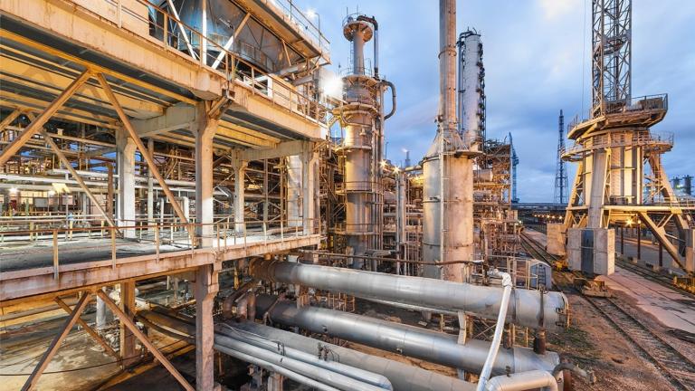 Today, most ammonia is produced using the Haber-Bosch process, a century-old method that relies on fossil fuels, in facilities like the one pictured. MIT researchers are developing computational approaches to identify materials that could enable a more sustainable alternative.