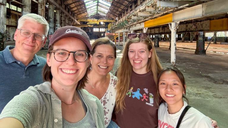 Sara Jex MCP ’25 (second from left) and family members visit 7000 Central Ave. in Cleveland, Ohio, a vacant 183,000-square-foot factory once used to manufacture Hulett unloaders. The building is among the first strategic acquisitions of the Site Readiness Fund for Good Jobs, which is working to redevelop disinvested industrial sites.