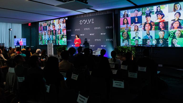 Hala Hanna, executive director of MIT Solve, addresses Solve Challenge Finals 2024 attendees.