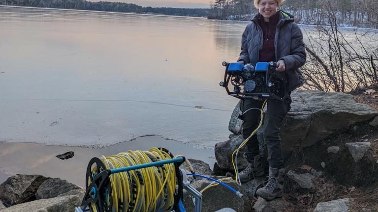 To determine the greenhouse gas emissions from thawing permafrost, MIT senior Sylas Horowitz has been developing a high-performance, remotely operated vehicle (ROV) that can collect water samples from beneath a sheet of Arctic ice. Here, Horowitz field tests the Arctic ROV at Lake Whitehall, Massachusetts.