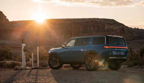 Image of electric Rivian vehicle at charging station