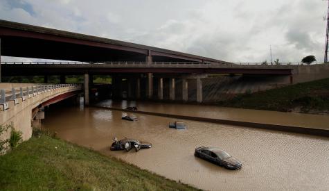 Abandoned cars are flooded with water after a 2014 storm in Detroit.