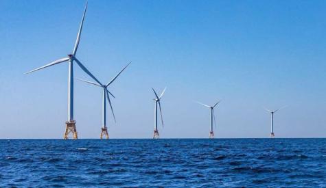 Photo: Deployment of offshore wind at utility scale is one of many strategies to reduce greenhouse gas emissions in alignment with net-zero emissions targets. (Source: Jesse Costa/WBUR)
