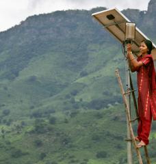 A solar engineer maintains the street lighting in her rural village of Tinginaput, India.
