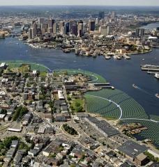 Aerial view photo montage of the Emerald Tutu in Boston Harbor, here shown flanking and protecting the waterfront areas of East Boston.
