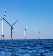 Photo: Deployment of offshore wind at utility scale is one of many strategies to reduce greenhouse gas emissions in alignment with net-zero emissions targets. (Source: Jesse Costa/WBUR)