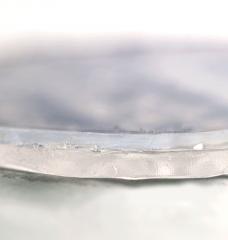 MIT researchers have developed a two-layer passive cooling system, made of hydrogel and aerogel, that can keep foods and pharmaceuticals cool for days without the need for electricity. In this photo showing a close-up of the two-layer material, the upper layer consists of aerogel and the bottom layer of hydrogel. 