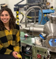 In the laboratory, Zoe Fisher uses a vacuum chamber to irradiate high-temperature superconductors with protons. It is attached to the particle accelerator — DANTE.