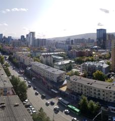 Elevated photo of city street and buildings.