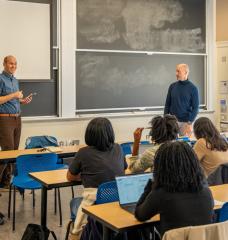 Class STS.059 (The Bioeconomy and Society) is taught jointly by professor of biological engineering Mark Bathe (standing, right) and associate professor of science, technology, and society Robin Wolfe Scheffler (standing, left). 