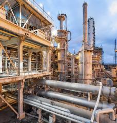 Today, most ammonia is produced using the Haber-Bosch process, a century-old method that relies on fossil fuels, in facilities like the one pictured. MIT researchers are developing computational approaches to identify materials that could enable a more sustainable alternative.