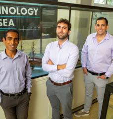 "The Nuclear Ship Safety Handbook" co-authors (left to right) Anthony Valiaveedu, Nat Edmonds, and Jose Izurieta pose in MIT's Hart Naval Gallery.