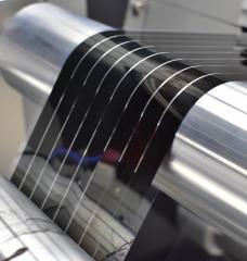 At Active Surfaces’ manufacturing development facility, the company tests and optimizes equipment for its first-of-its-kind commercial-scale manufacturing plant. Here, a solar energy film is fabricated in an industrial roll-to-roll printer — a device key to cost-effective mass production. 
