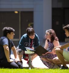 Left to right: Fabian Velasquez, Rafael Olivera-Cintron, Katherine Mohr, and Michael Lu test their solar-powered sensor in a sunny spot on the MIT campus. 