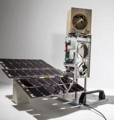 The TROPICS Pathfinder satellite, pictured here, was launched on June 30. The satellite body measures approximately 10 cm X 10 cm X 36 cm and is identical to the six additional satellites that will be launched in the constellation in 2022. The golden cube at the top is the microwave radiometer, which measures the precipitation, temperature, and humidity inside tropical storms.